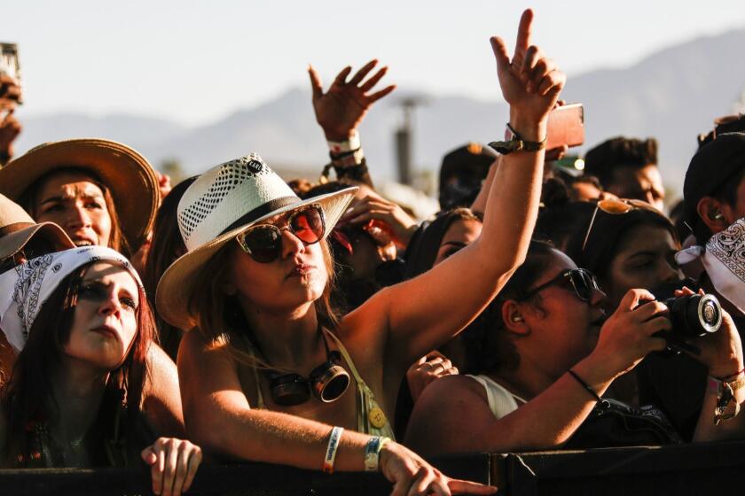 INDIO,CA -- SUNDAY, APRIL 22, 2018-- Fans of Cardi B rap along during her performance at the Coachella stage Sunday during weekend two. (Maria Alejandra Cardona / Los Angeles Times)