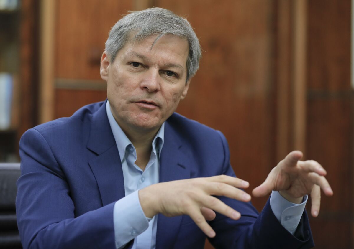 FILE - In this Friday, Dec. 9, 2016 file photo, Dacian Ciolos gestures during an interview with the Associated Press in Bucharest, Romania. Romania's president has nominated centrist party leader Dacian Ciolos to be prime minister after a protracted political crisis culminated last week in the Liberal-led coalition government being ousted in a no-confidence vote. After a day of deliberations Monday, Oct. 11, 2021 with Romania’s political parties, President Klaus Iohannis nominated USR leader Ciolos to try to form a government. (AP Photo/Vadim Ghirda, file)