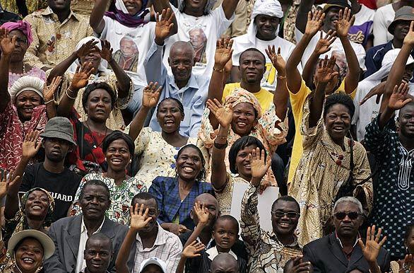 Cameroonians greet Pope Benedict XVI at a stadium in Yaounde, the capital, where he was to celebrate Mass. The pope earlier called on Cameroon's bishops to defend the traditional African family from the dangers of modernity and secularization.