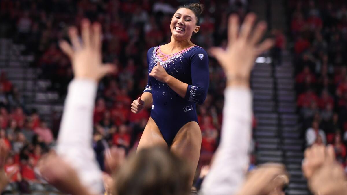 Kyla Ross celebrates her perfect score in floor exercise during the Pac-12 championships in Salt Lake City last month.