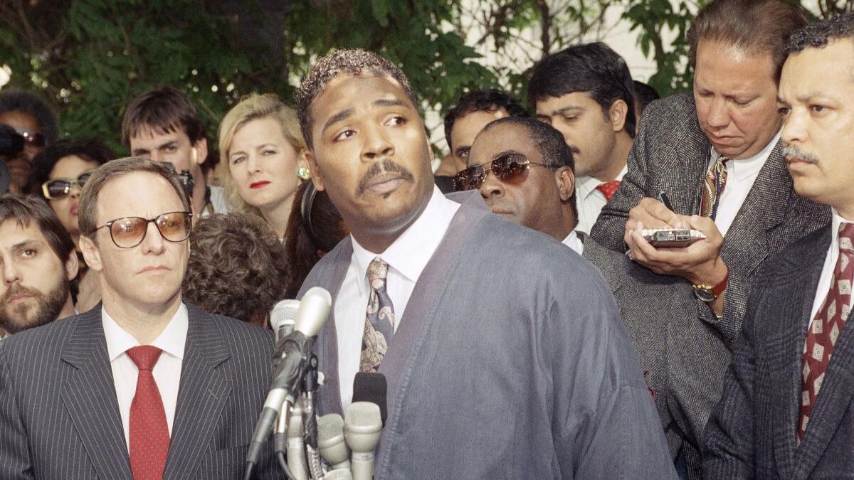 Rodney King speaks during a news conference in Los Angeles pleading for the end to the rioting that plagued the city in 1992 after four police officers were found not guilty beating case. Attorney Barry Kowalski later won convictions against two of the officers.
