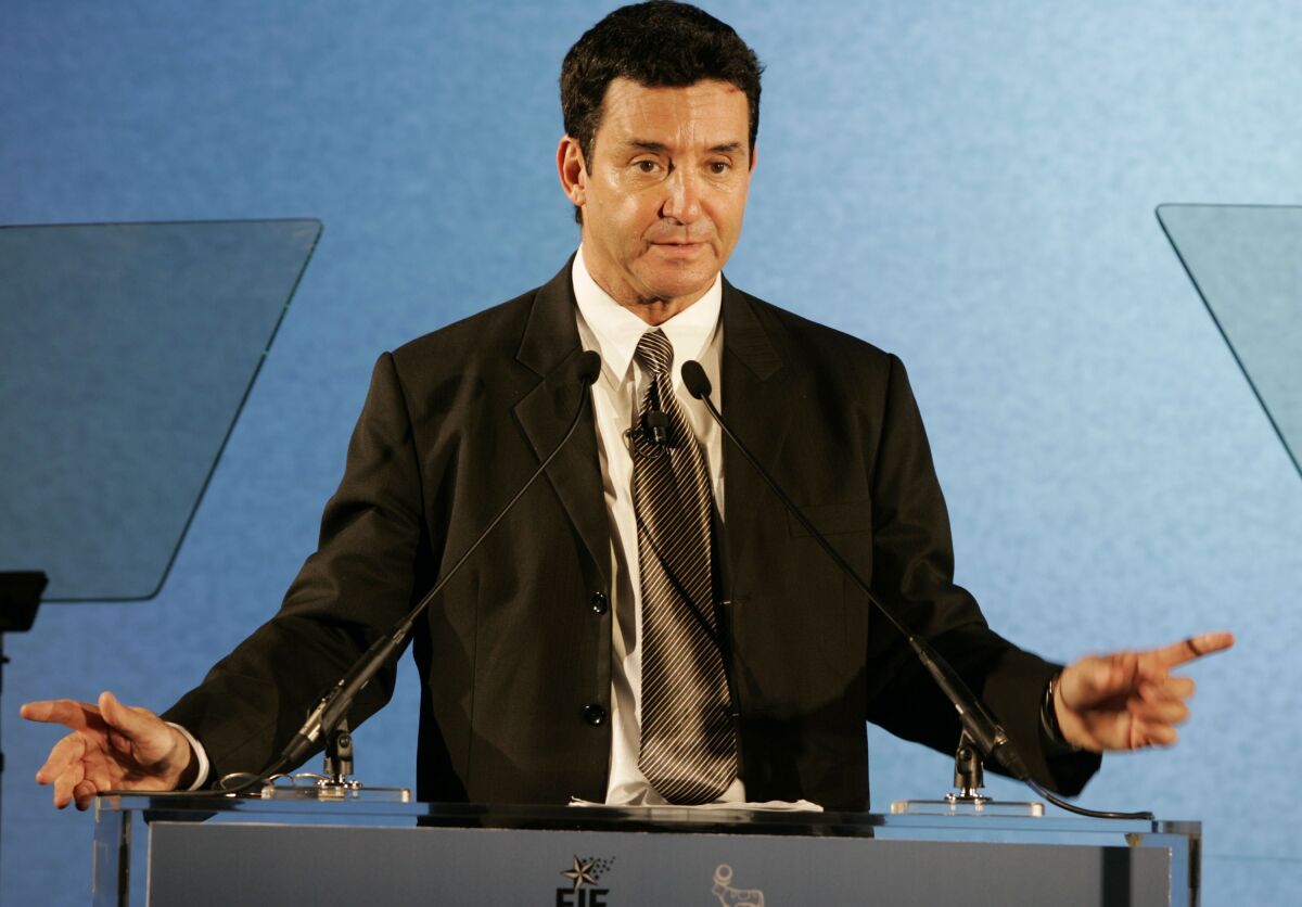 A doctor speaks at a podium. 