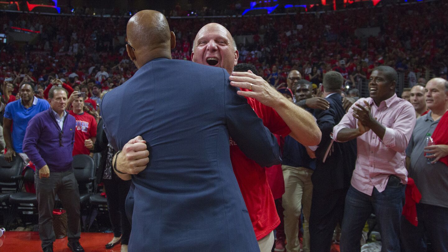 Clippers owner Steve Ballmer, right, celebrates with Clippers assistant coach Sam Cassell after the team's 111-109 win over the San Antonio Spurs in Game 7 of the Western Conference quarterfinals on May 2, 2015.