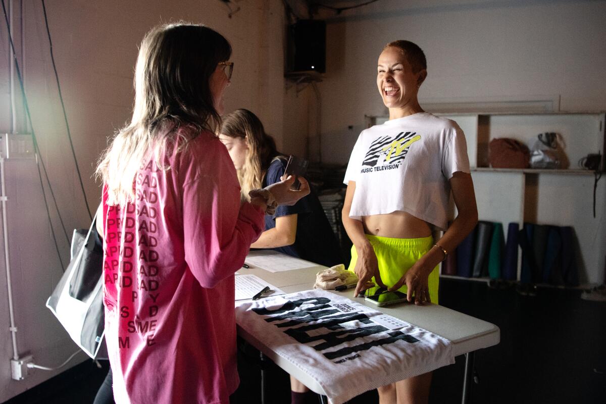 Ashleigh Wilson-Clarke checks in participants of the Dance Church before class starts. 