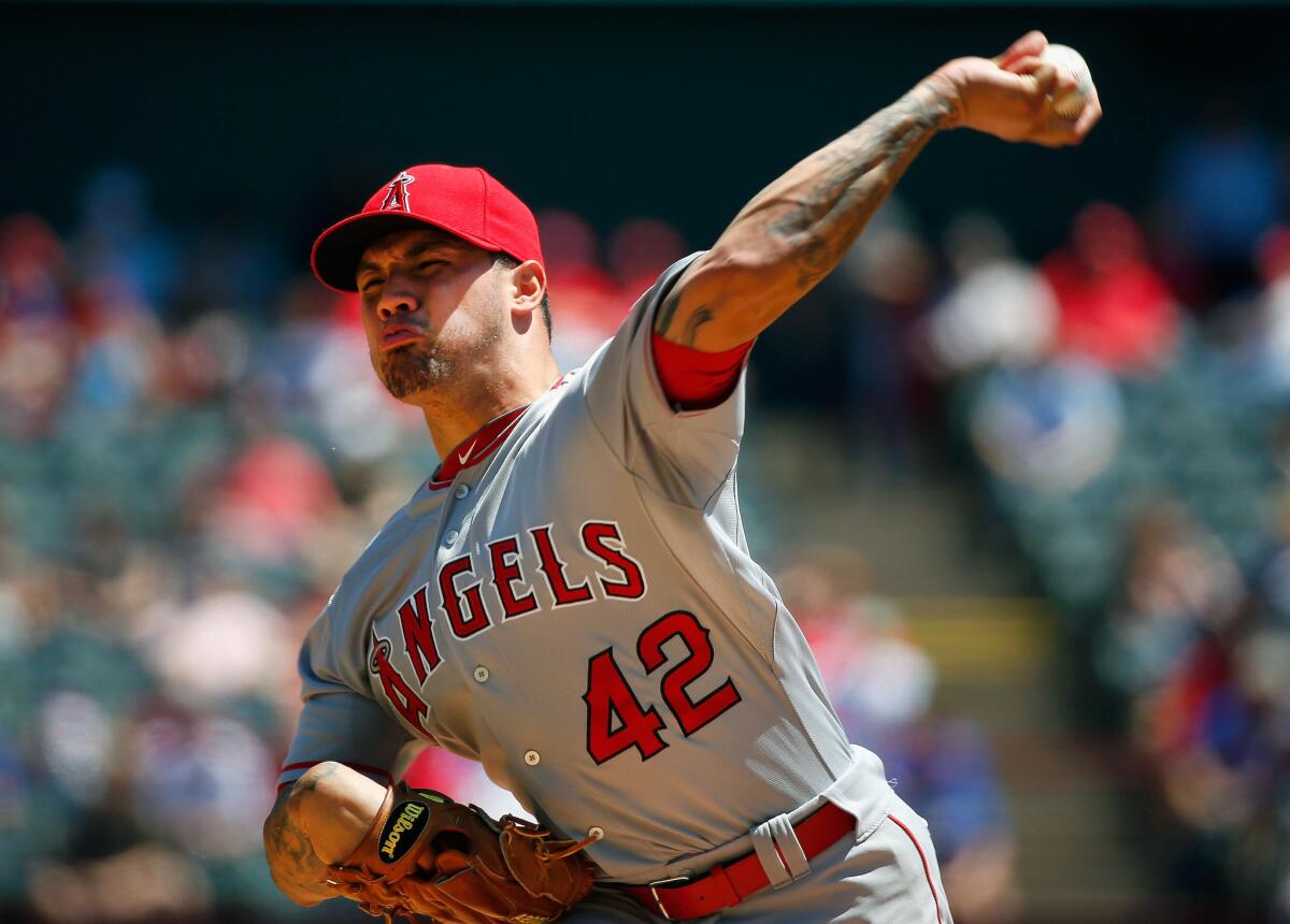 Angels starter Hector Santiago delivers a pitch in the first inning against the Texas Rangers.