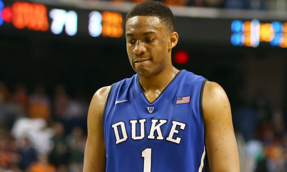 Duke's Jabari Parker walks off the court following the Blue Devils' loss to Virginia in the ACC tournament on March 16.
