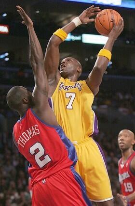 Laker Lamar Odom shoots over Clipper Tim Thomas during first quarter at the Staples Center Tuesday.