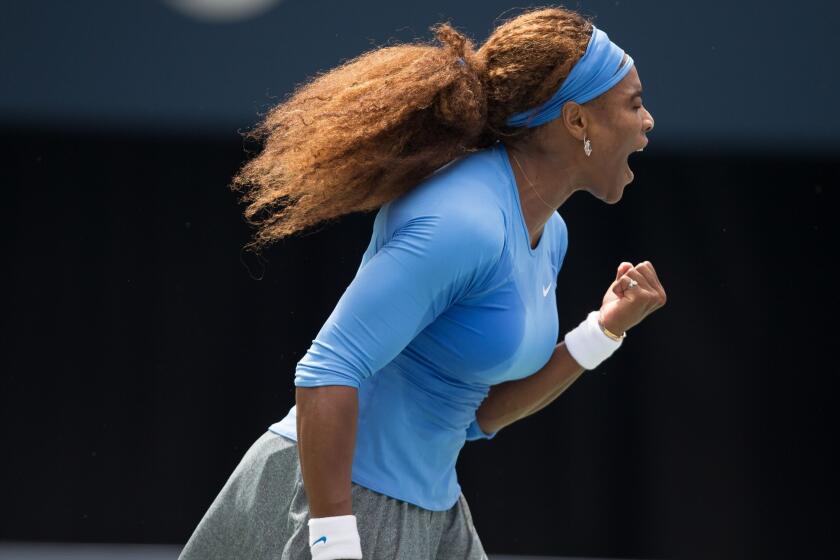 Serena Williams reacts after earning a point against Sorana Cirstea in the Rogers Cup women's championship match on Sunday in Toronto.