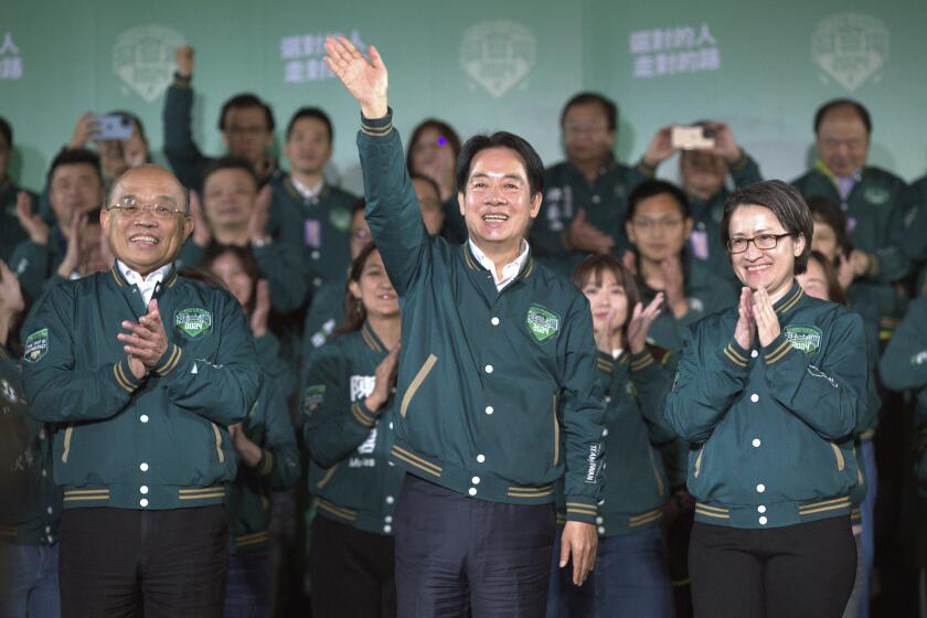 Taiwanese Vice President Lai Ching-te, also known as William Lai, center, celebrates his victory with running mate Bi-khim Hsiao, right, and supporters in Taipei, Taiwan., Saturday, Jan. 13, 2024. Ruling-party candidate Lai Ching-te has emerged victorious in Taiwan''s presidential election and his opponents have conceded. The result in Taiwan''s presidential and parliamentary election will chart the trajectory of relations with China over the next four years. (AP Photo/Chiang Ying-ying)