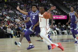 Southern California guard Isaiah Collier (1) drives against Kansas State guard Tylor Perry.