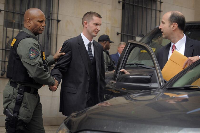 Baltimore Police Officer Edward Nero leaves the courthouse after he was acquitted of all charges.