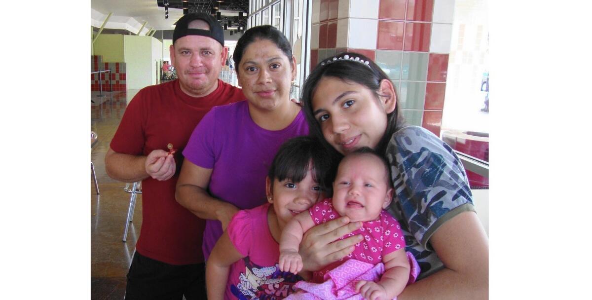 Hiram Ramirez, 28, second from left, was denied a birth certificate for her newborn daughter, Dulce, in McAllen, Texas. She is seen with her husband, Eduardo Mendo, 41, and daughters Alejandra Mendo, 3, and Esli Mendo, 14.