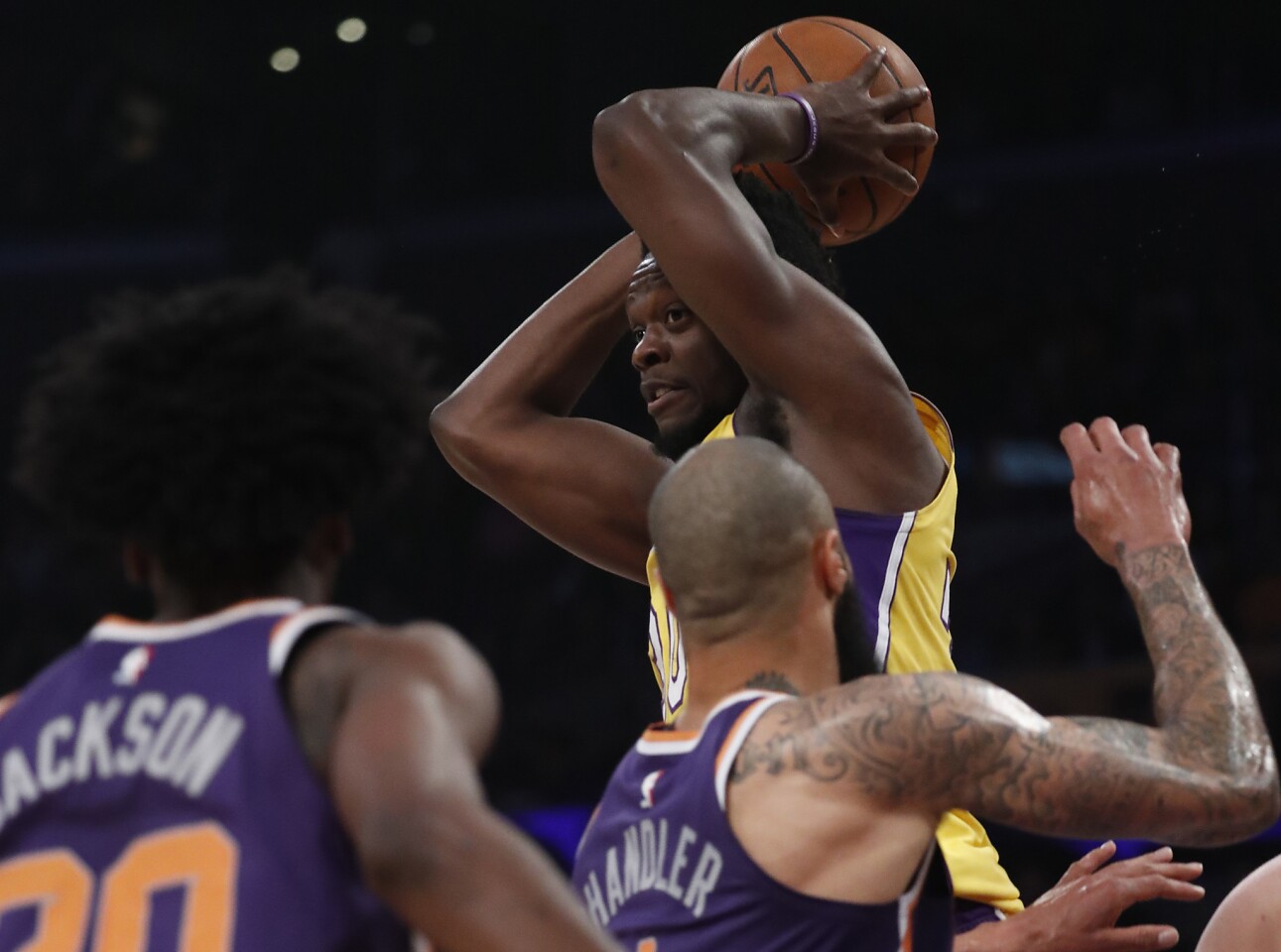 Lakers forward Julius Randle looks to pass during the first quarter of a game against the Suns on Tuesday at Staples Center.