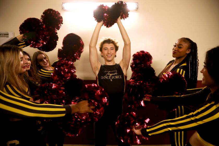 LOS ANGELES, CA - JANUARY 27, 2024 - - Hugo Miller, center, is surrounded by his fellow USC's Trojan Dance Force.