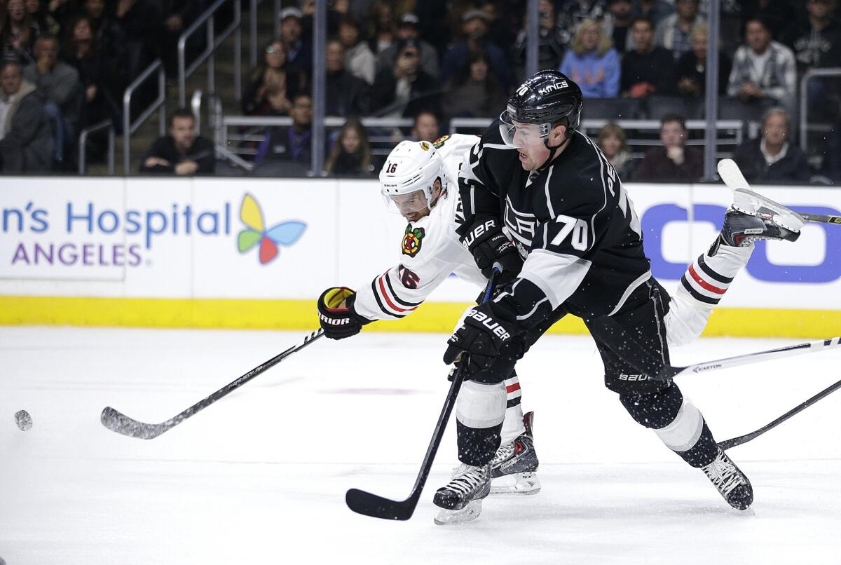 Kings left wing Tanner Pearson battles for the puck with Chicago's Marcus Kruger earlier in the season.