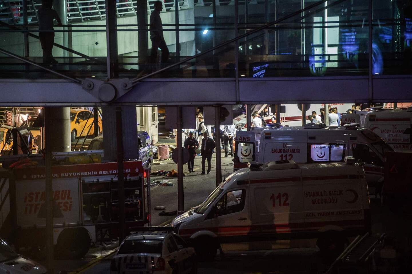 Forensic police work at the Ataturk airport explosion site.