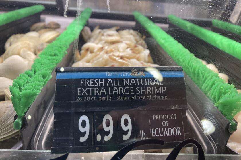 FILE - The price of shrimp is displayed at a market in Philadelphia, Thursday, June 16, 2022. (AP Photo/Matt Rourke, File)