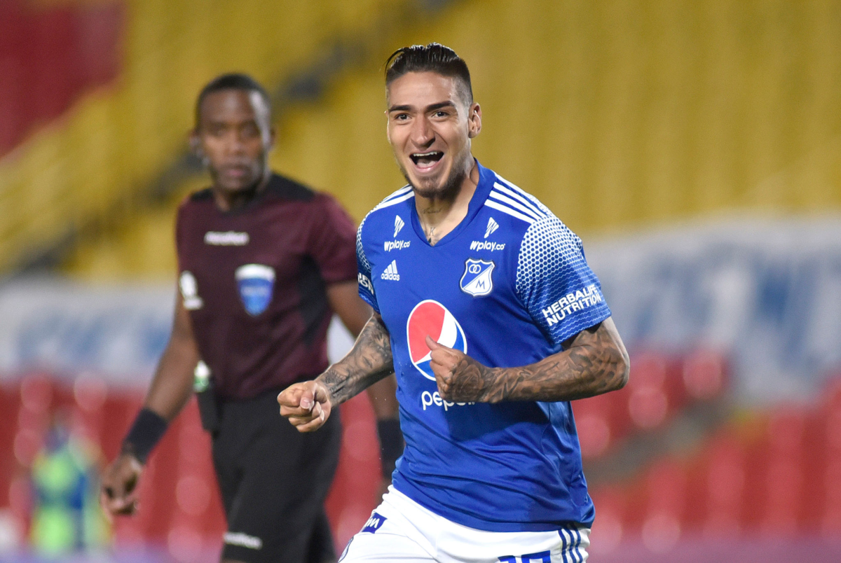 Cristian Arango of Millonarios celebrates after scoring a goal.