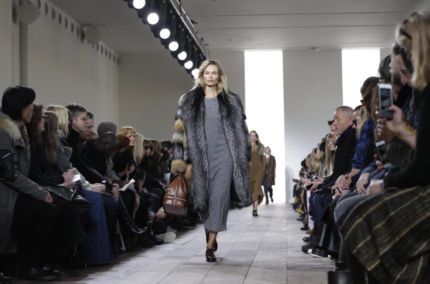 Model Natasha Poly presents a creation from the Fall 2015 collection by Michael Kors during the New York Fashion Week. Complete updates from New York Fashion Week 2015 | Celebrities at New York Fashion Week | New York Fashion Week: Street Style