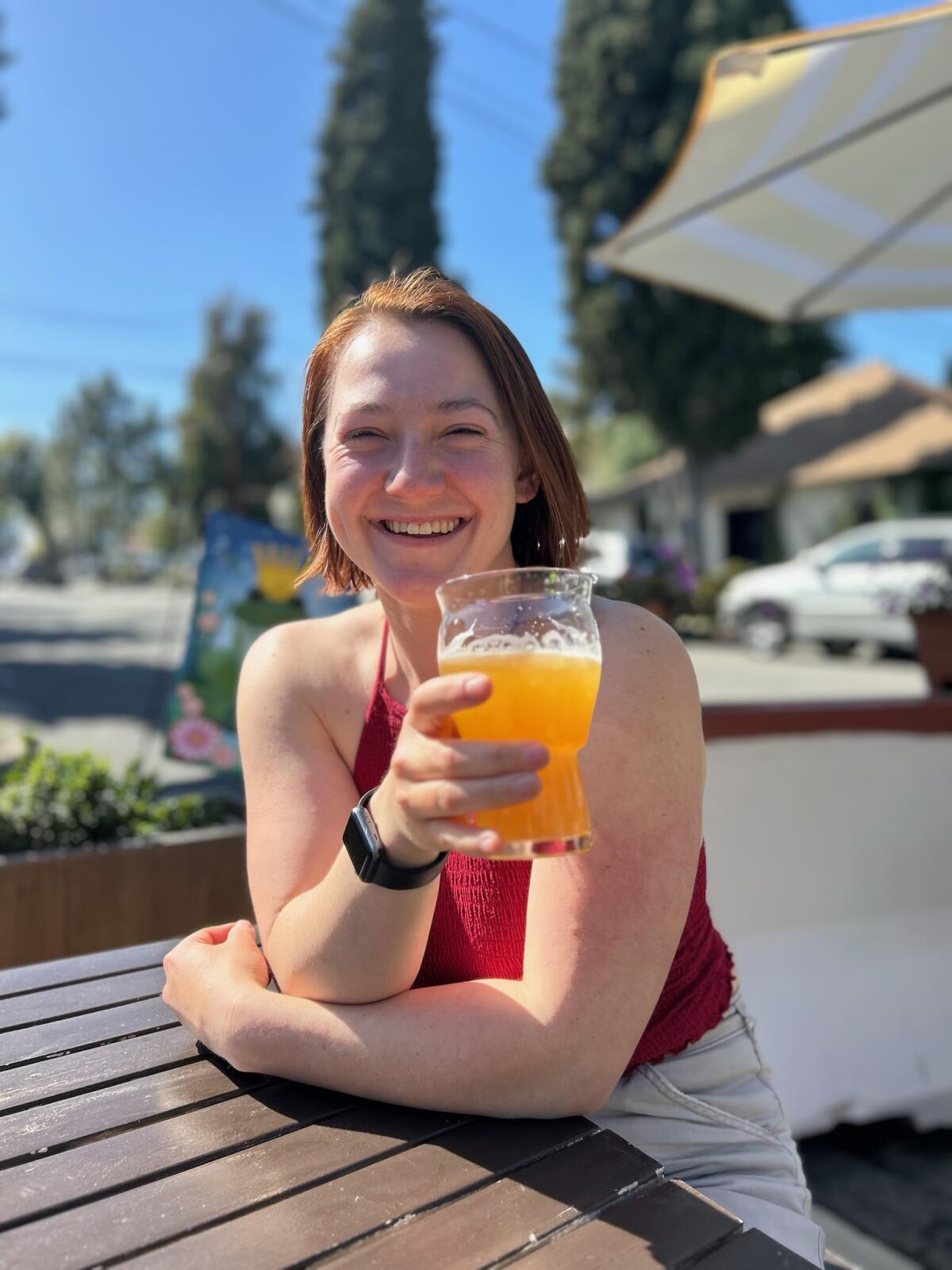 Travel writer Johanna Flashman sips a beer.