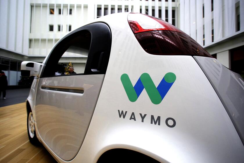 FILE - In this Dec. 13, 2016, file photo, the Waymo driverless car is displayed during a Google event in San Francisco. Uber is settling a lawsuit filed by Google’s autonomous car unit alleging that the ride-hailing service ripped off self-driving car technology. Both sides in the case issued statements confirming the settlement Friday, Feb. 9, 2018, morning in the midst of a federal court trial in the case. (AP Photo/Eric Risberg, File)