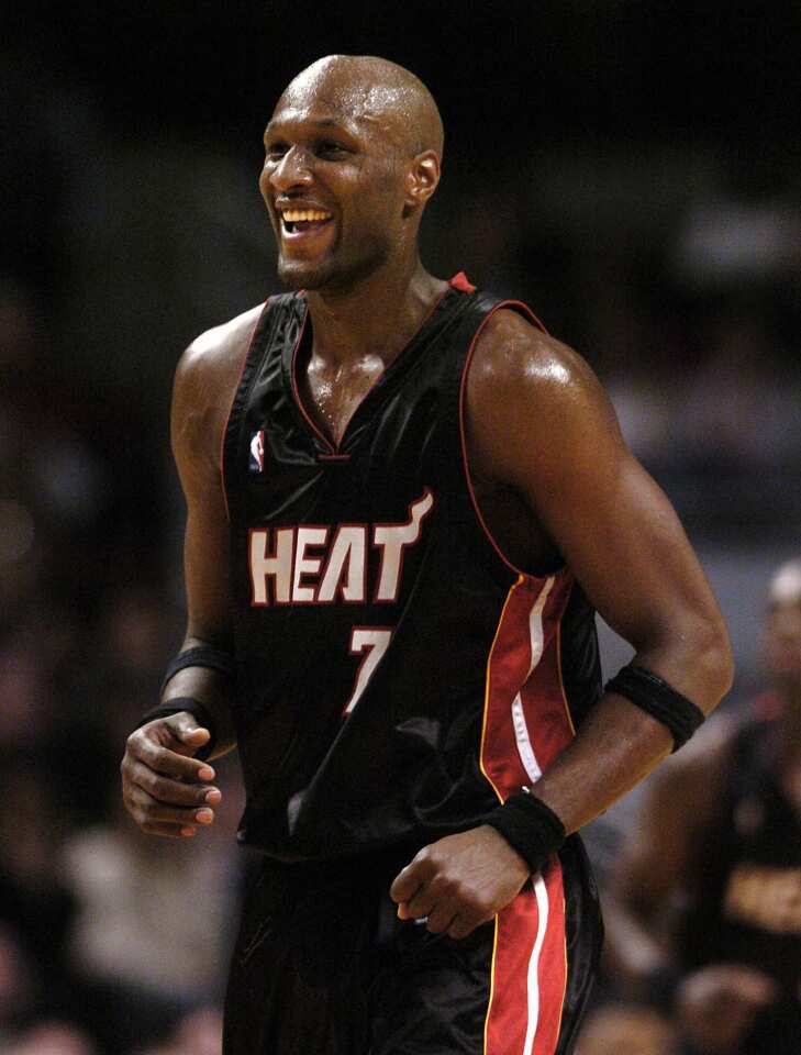 Heat forward Lamar Odom is all smiles after making a three-point shot in the fourth quarter of a game against the Chicago Bulls. Odom scored 25 points to lead Miami to a 90-83 victory.