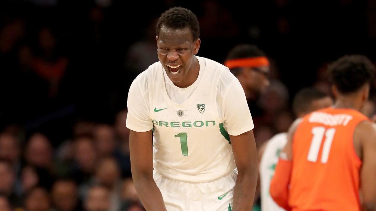Oregon's Bol Bol celebrates a three-pointer against Syracuse at Madison Square Garden in November 2018. The 7-foot-2 Bol Bol, who starred at Santa Ana Mater Dei High, played only nine games at Oregon, averaging 21 points and nine rebounds.