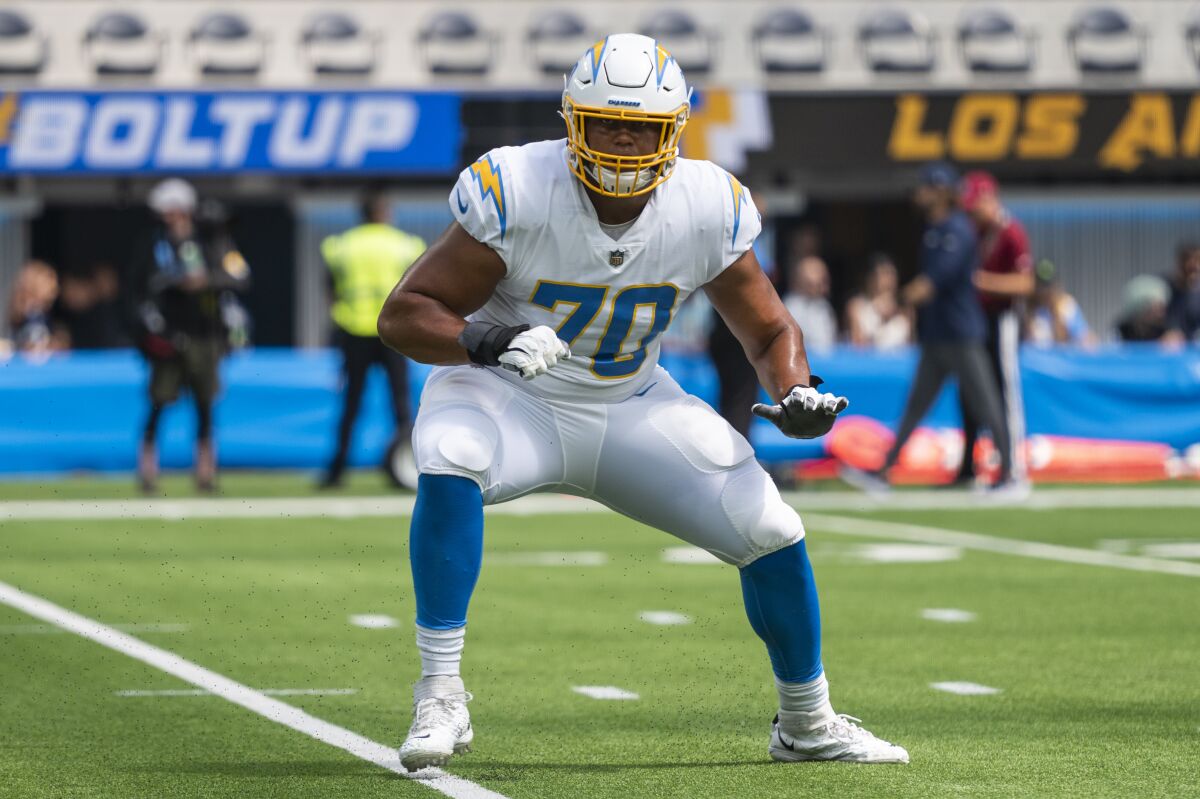 Chargers offensive tackle Rashawn Slater warms up before a game against the Dallas Cowboys on Sept. 19.