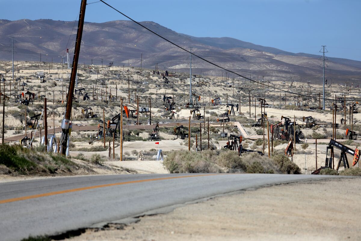 TAFT, CA - MARCH 10: Oil pumpjacks in the hills along State Route 33 (SR 33) on Thursday, March 10, 2022 in Taft, CA. The Biden Administration's to stop importing Russian oil and gas in response to the Russian invasion of Ukraine has recharged the debate over oil development in California, placing building pressure on Gov. Gavin Newsom to OK new drilling projects. (Gary Coronado / Los Angeles Times)