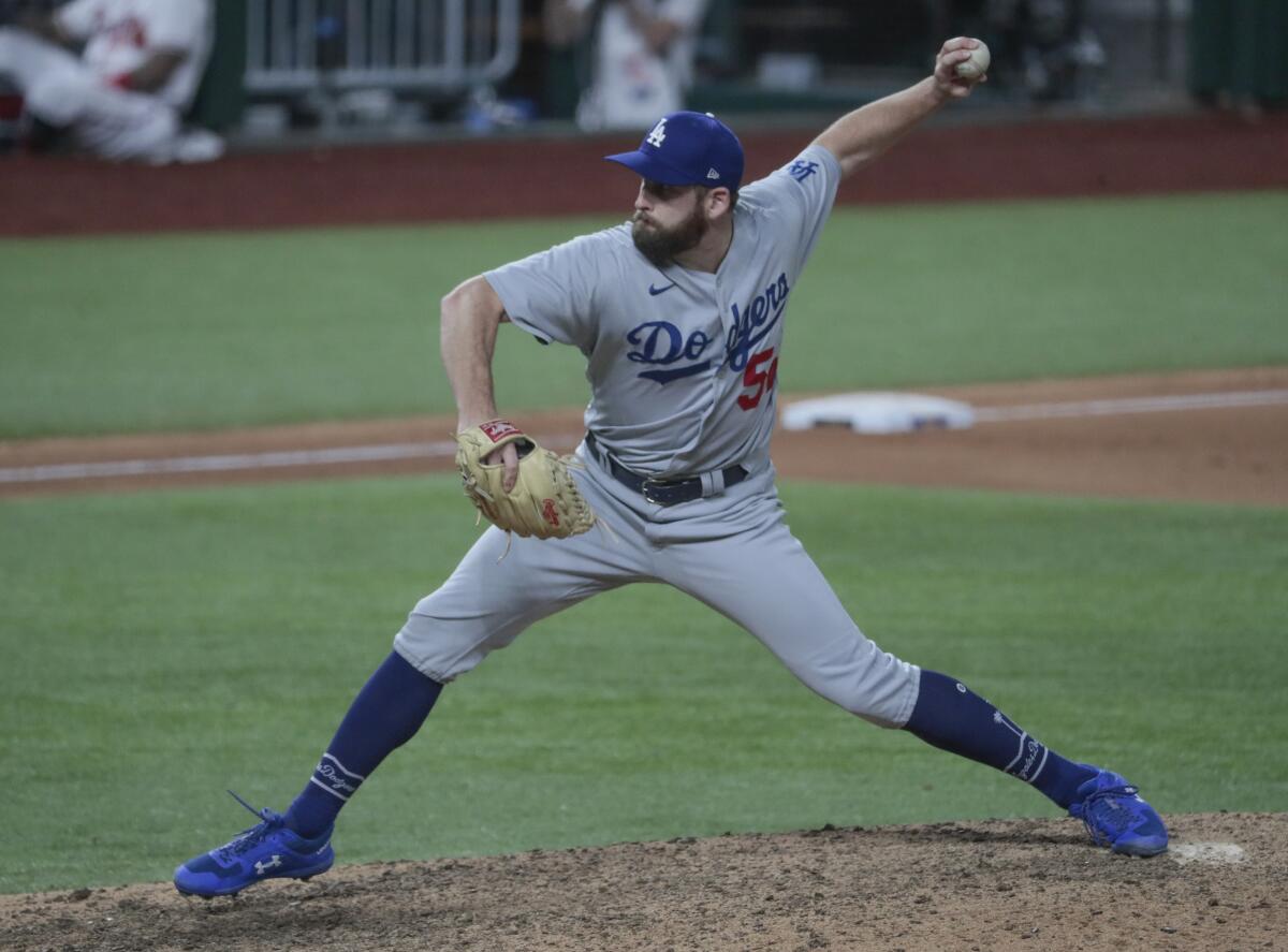Dodgers relief pitcher Adam Kolarek pitches the ninth inning of a 15-3 win over the Atlanta Braves.