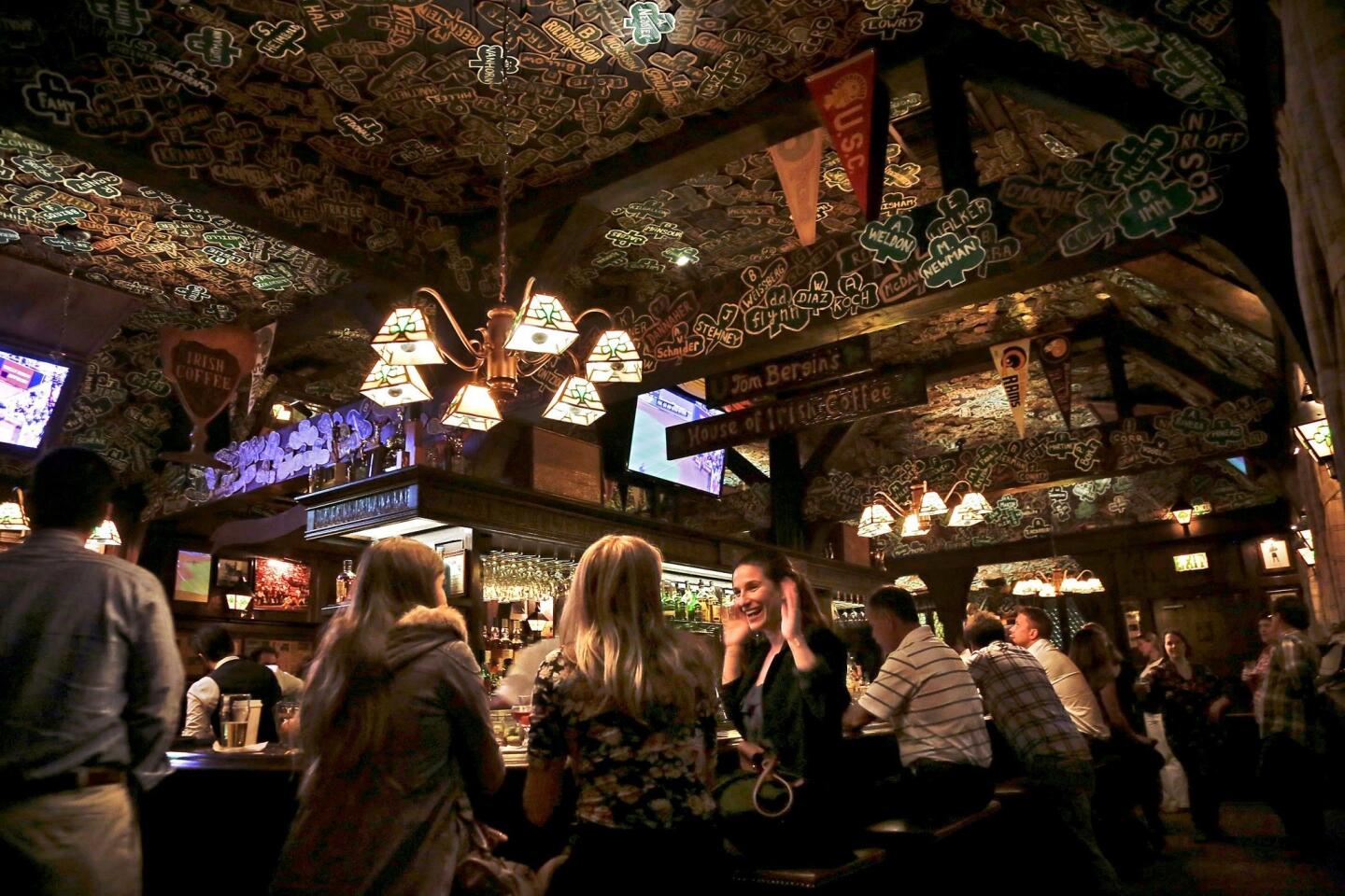 The bar area at Tom Bergin's is covered with shamrocks.