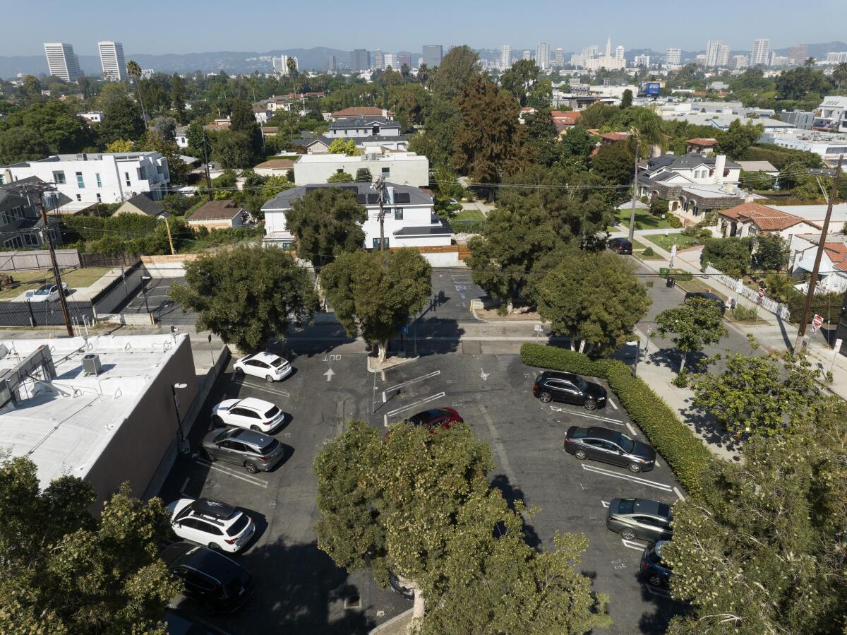 An aerial view of a parking lot near residential streets.
