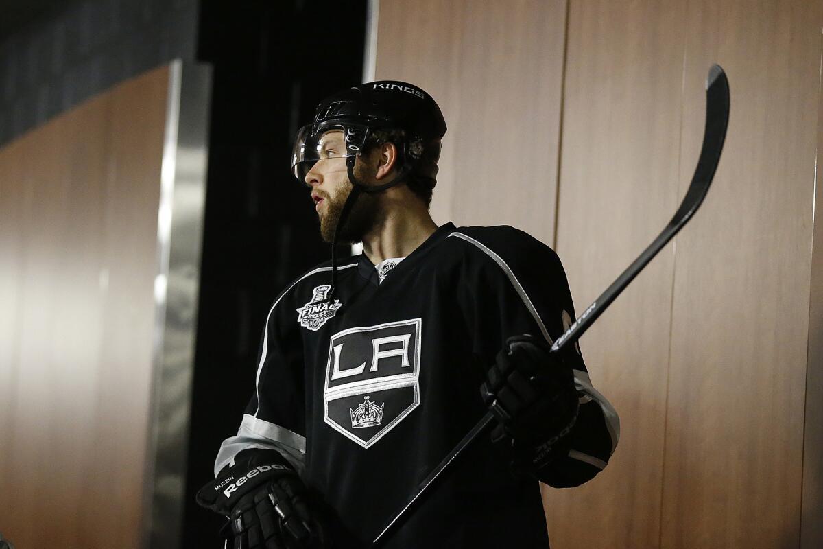Kings defenseman Jake Muzzin suffered an upper body injury against the Avalanche.