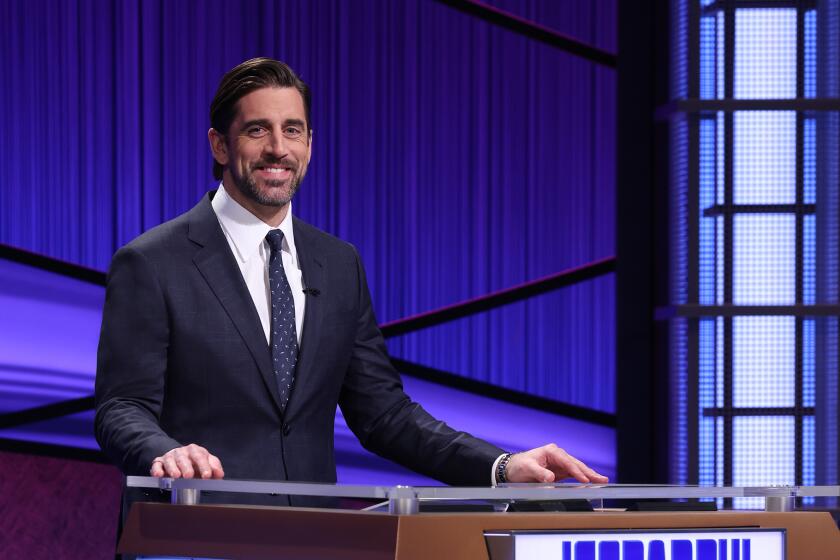 Aaron Rodgers at the lectern for his guest host sting on "Jeopardy!"