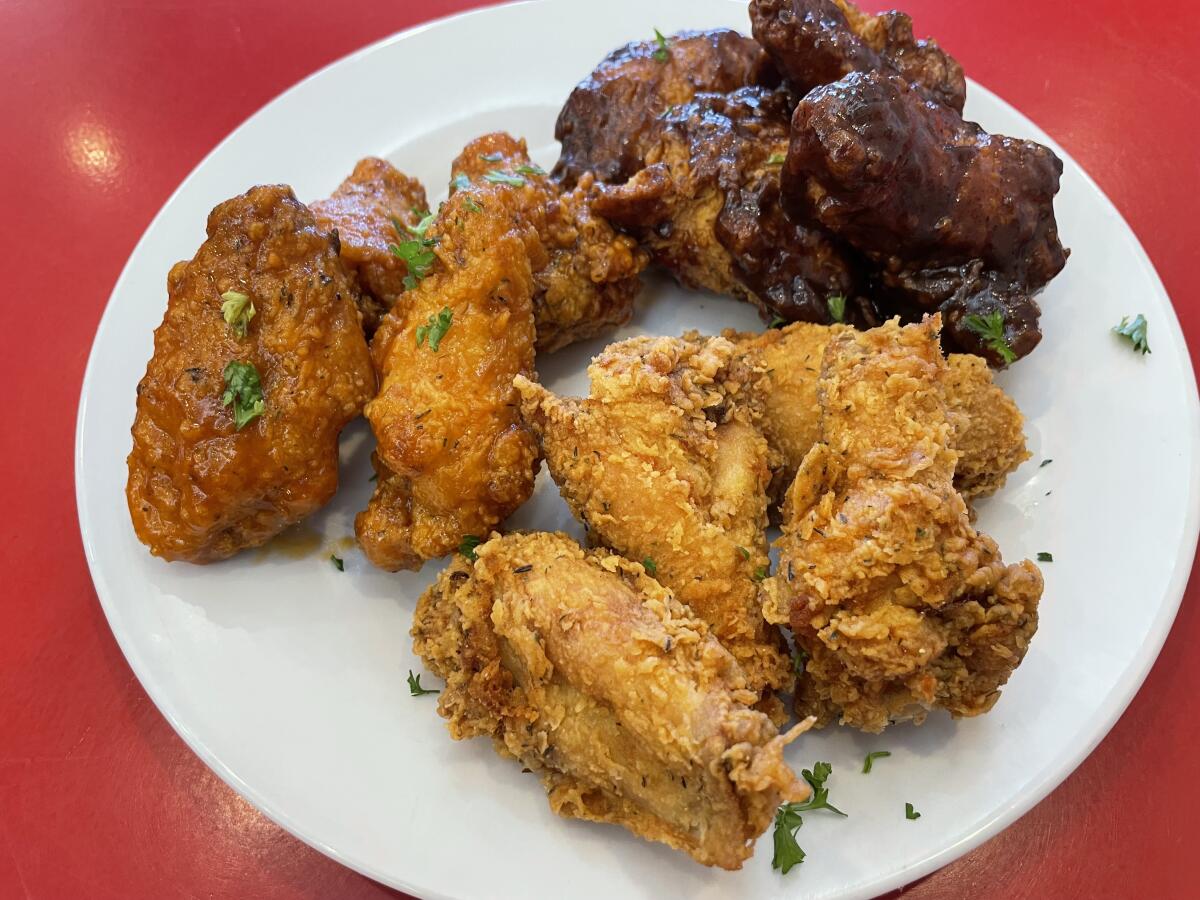 An assortment of chicken wings on a plate.