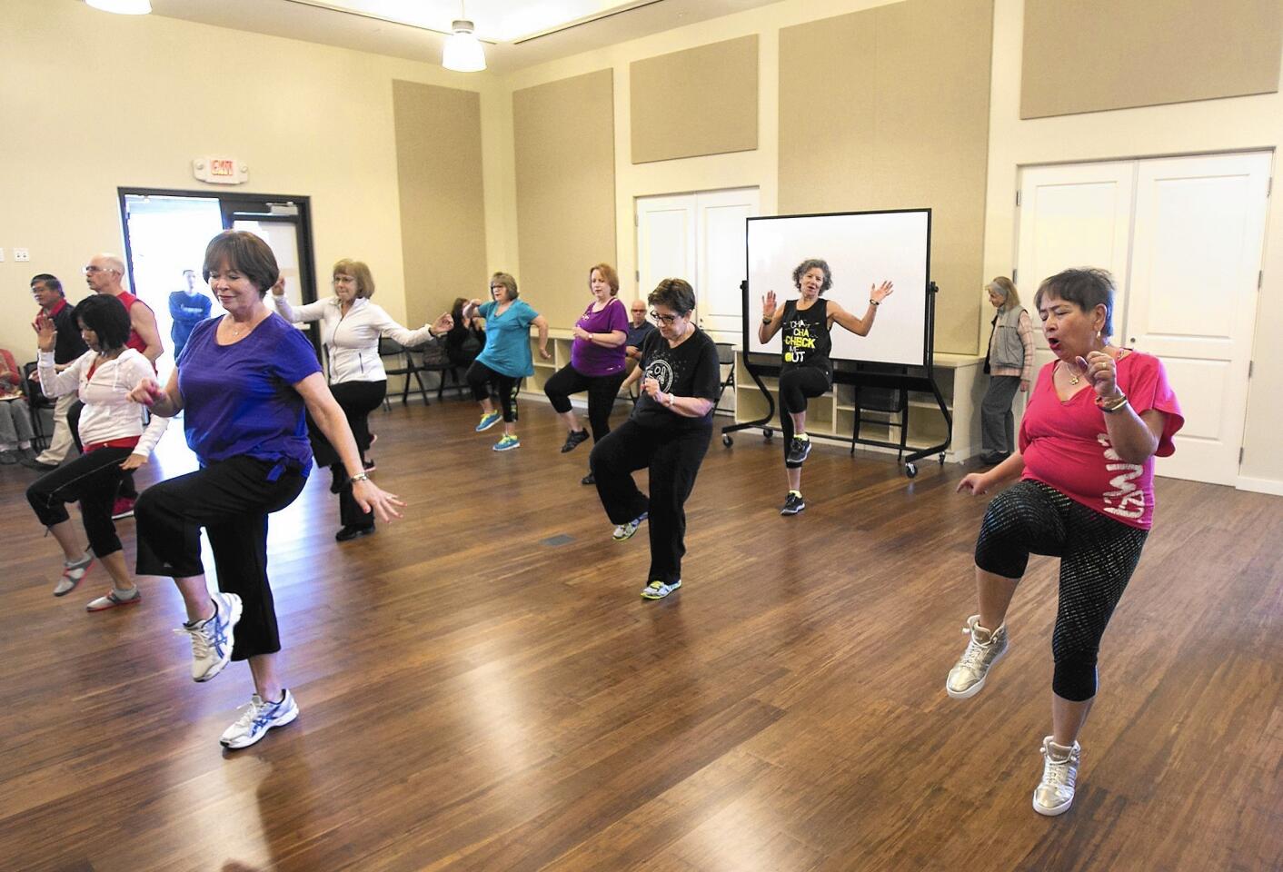 A Zumba class gets underway during public grand opening ceremony of the Trabuco Center, Irvine's third senior center on Saturday. The new center features the latest exercise equipment, fitness programs, and free Wi-Fi in the courtyard.
