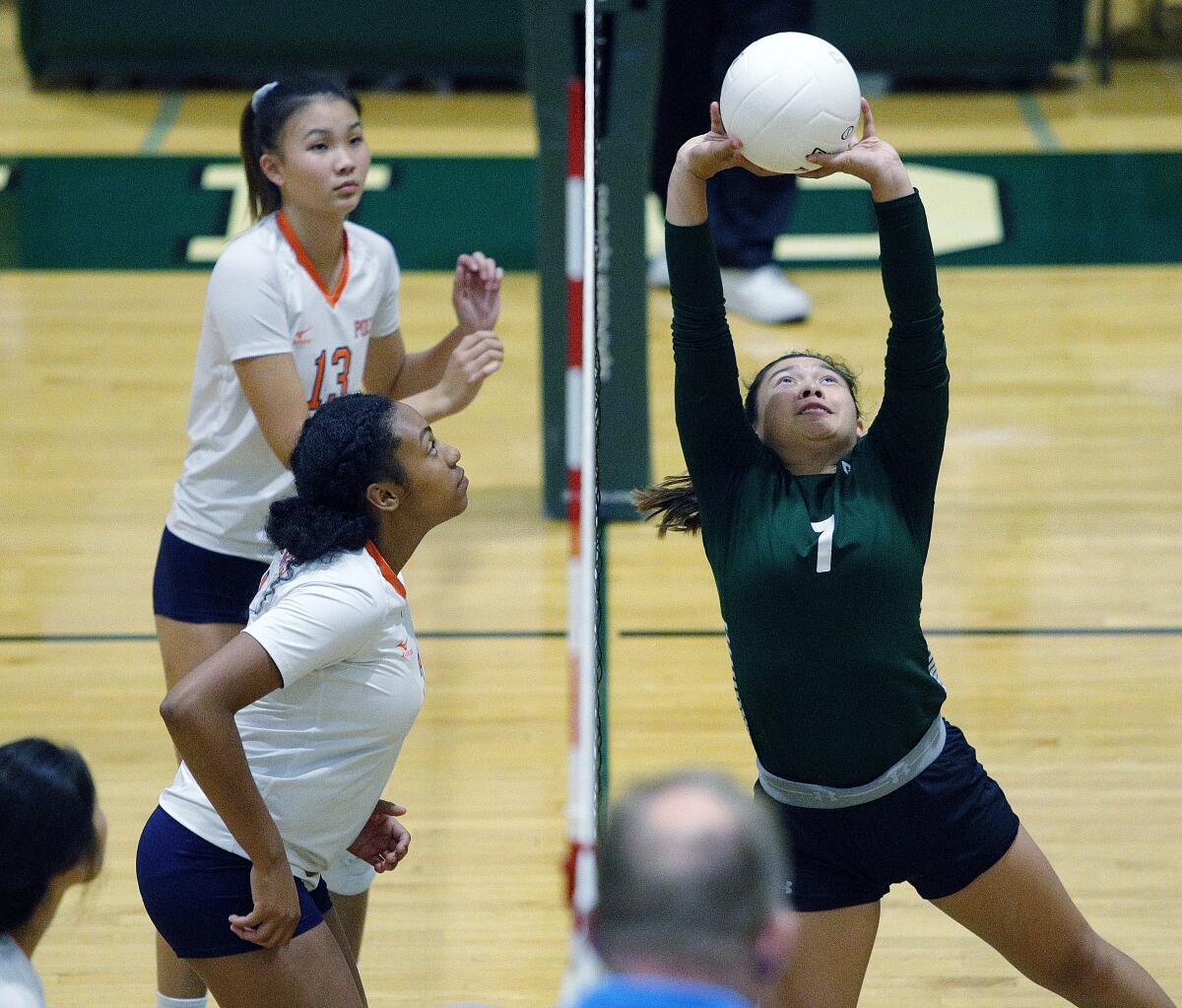 Providence's Jennifer Tolentino sets the ball for a kill against Polytechnic's Laila Ward in a Prep League girls' volleyball match at Providence High School on Tuesday, September 17, 2019.
