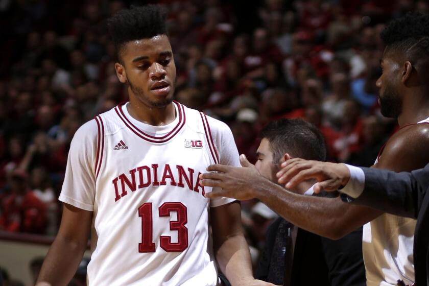 Indiana forward Juwan Morgan (13) gets congratulations from the bench as he exits the game in the second half.