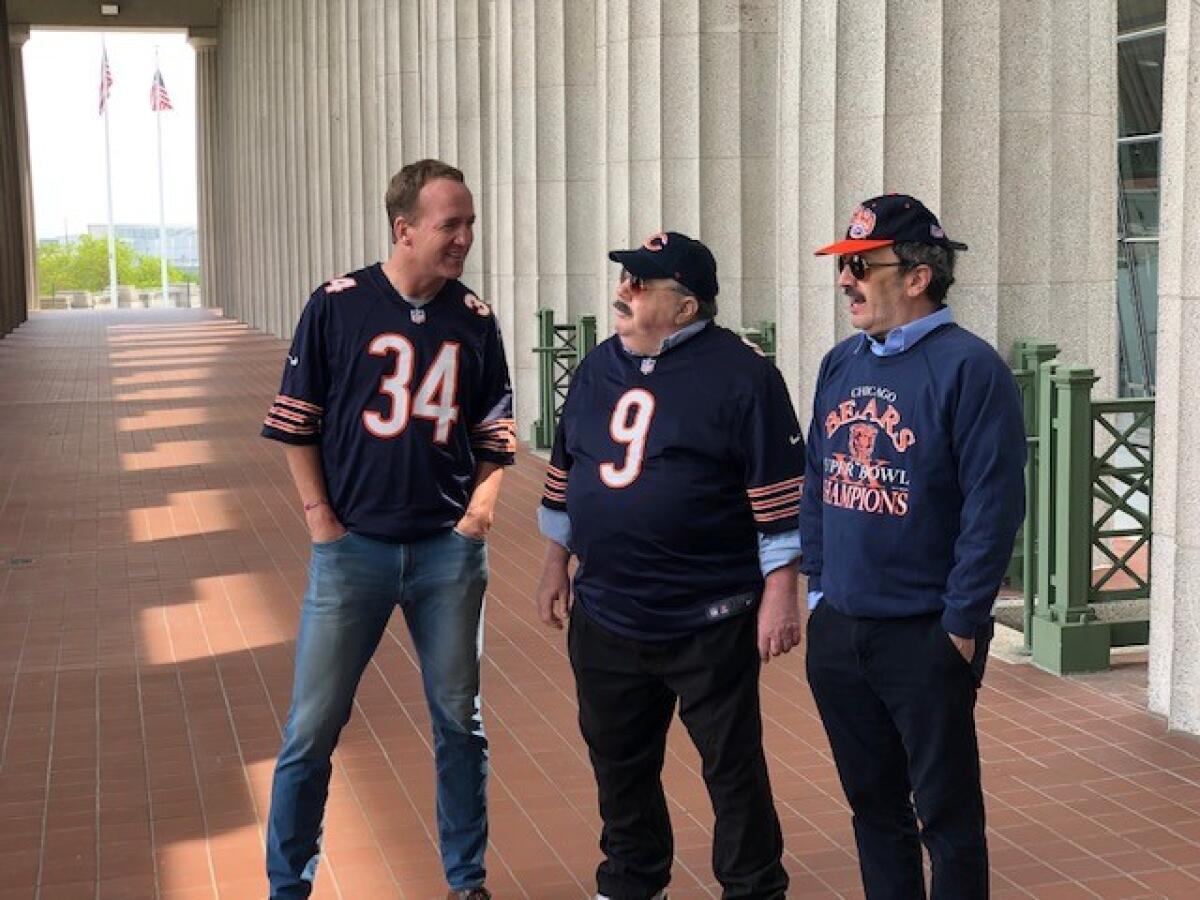 Peyton Manning, left, shoots a "Da Bears" skit with George Wendt and Robert Smigel at Soldier Field.