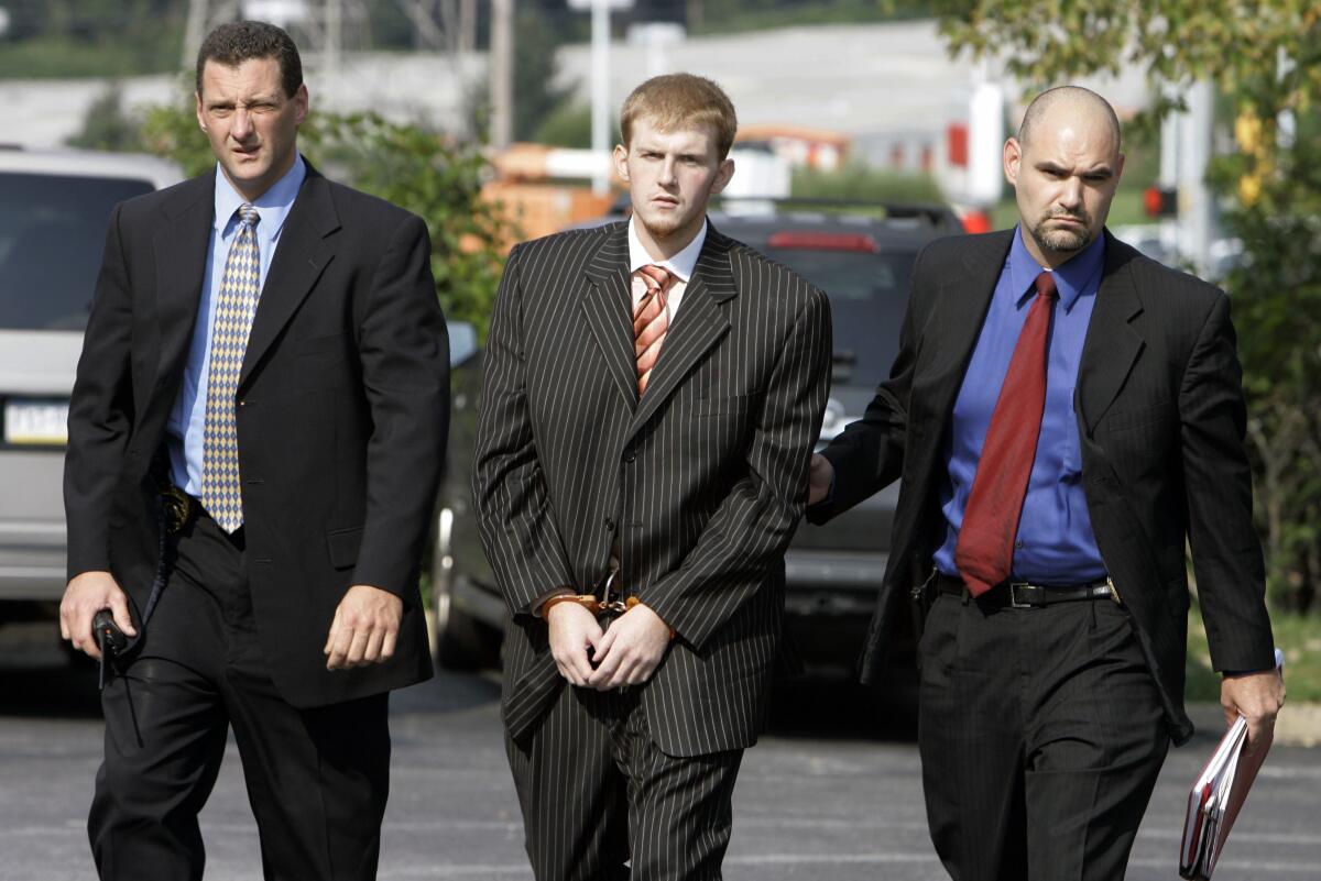 FILE - In this Aug. 29, 2007, file photo, Britt Reid is escorted into the Montgomery County district court house in Conshohocken, Pa. Former Kansas City Chiefs assistant coach Britt Reid is scheduled to enter a guilty plea to felony driving while intoxicated related to a car crash that seriously injured a young girl. Jackson County Circuit Court online records show Reid, the son of Chiefs coach Andy Reid, is scheduled to plead guilty on Monday, Sept. 12, 2022. (AP Photo/Matt Rourke, File)