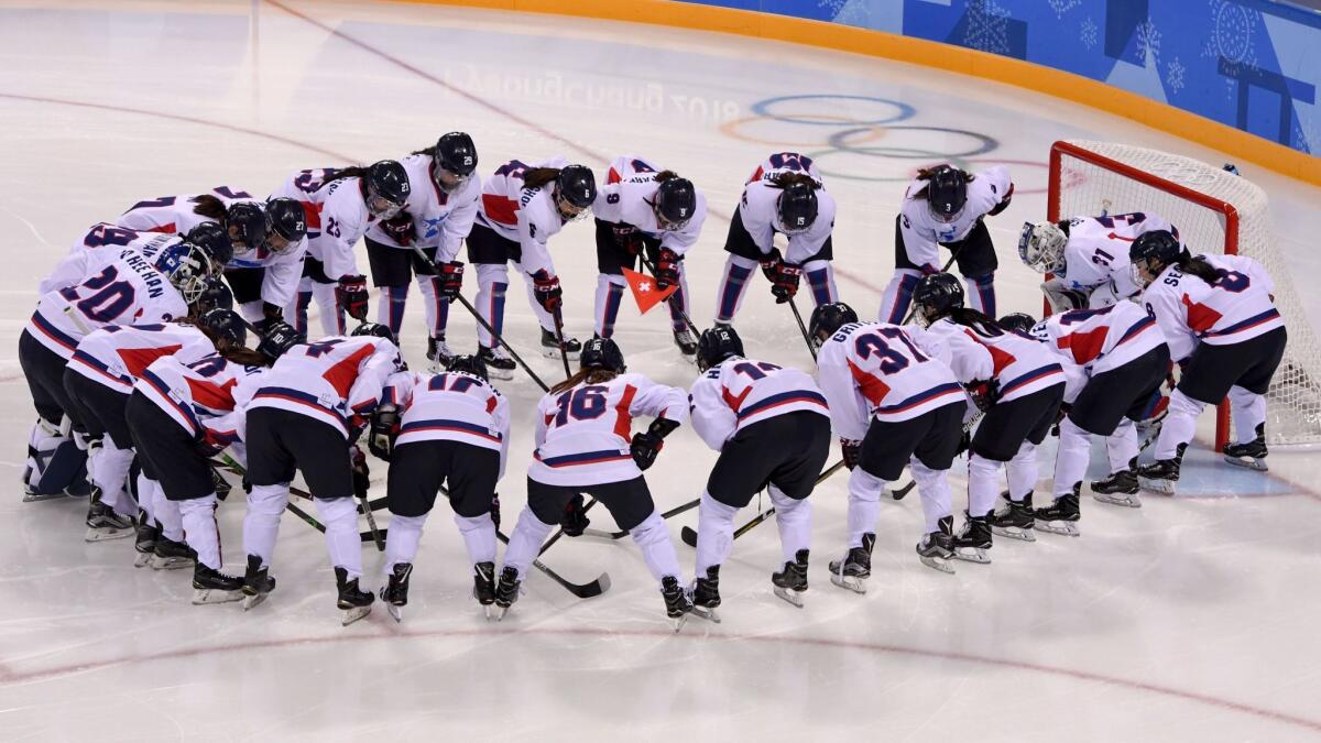 The Unified Korean team gathers before playing Switzerland.