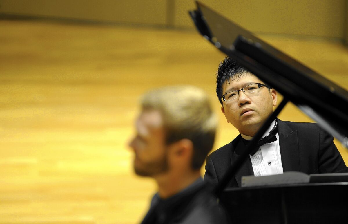 Tyler Reece, left, and Po Hsun Chen perform music by composer Mark Carlson during the SongFest 2015 concert series, "A Celebration of LA Composers," at Zipper Hall at Colburn School in downtown Los Angeles on June 21, 2015.