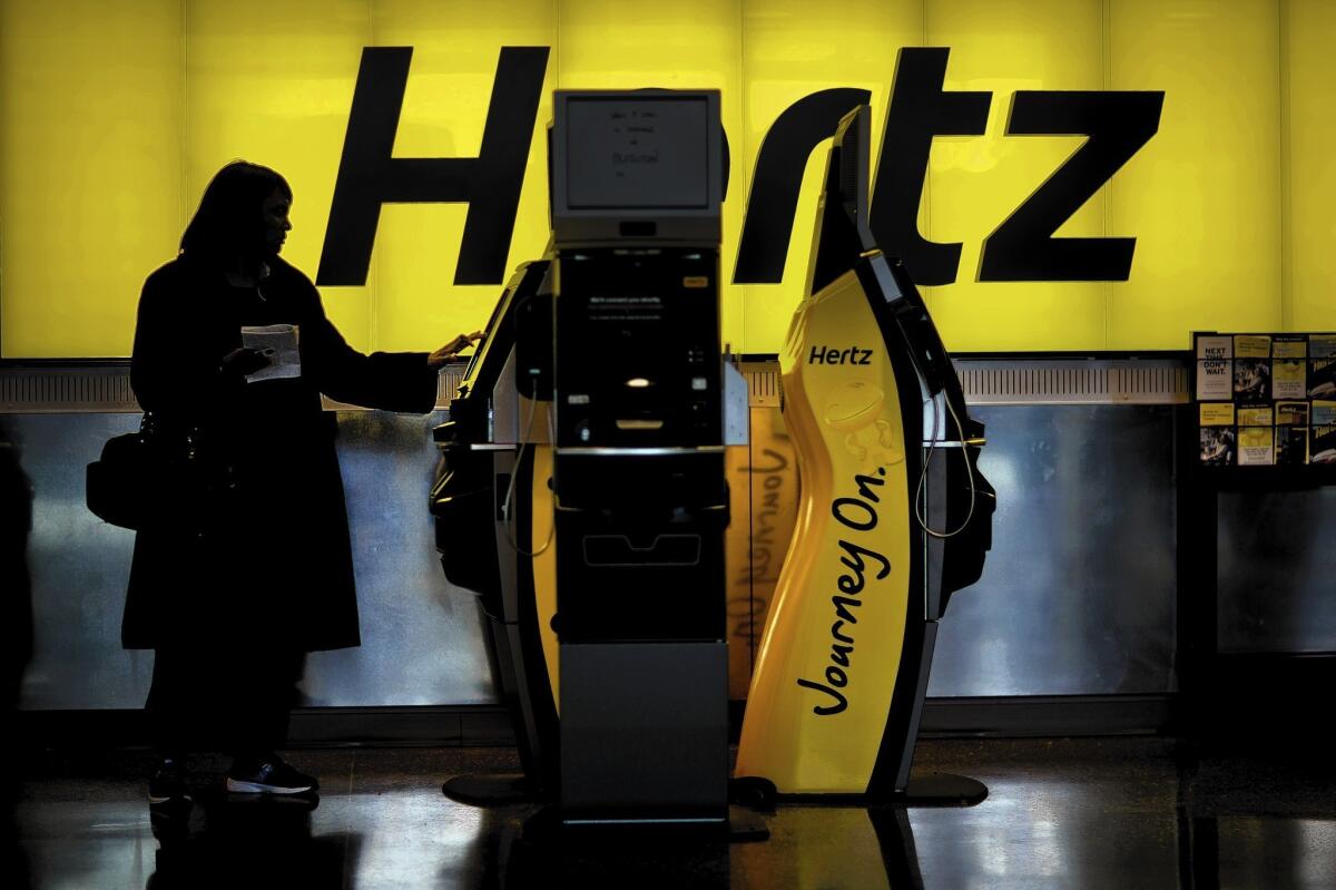 Hertz has begun to use a biodegradable spray solution that is wiped off with microfiber towels at 220 locations across the country. Next year, Hertz hopes to expand the program to all 3,700 locations in the U.S. and Europe, saving more than 130 million gallons of water annually. Above, a Hertz rental counter at Hartsfield-Jackson Atlanta International Airport last month in Atlanta.