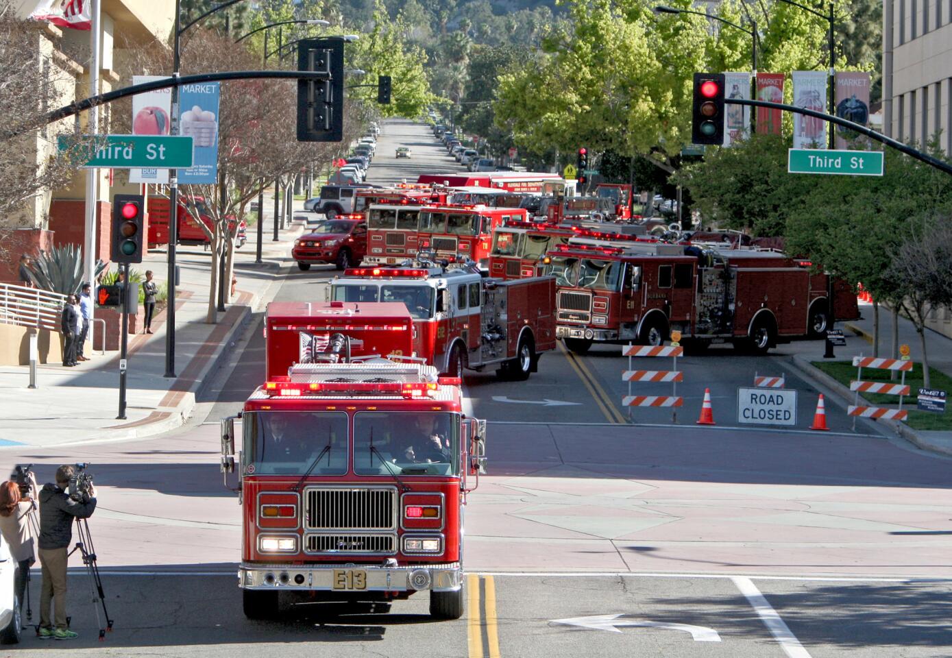 About 150 Burbank Fire Department members begin their trip to Corona for Ken Anderson's funeral service.