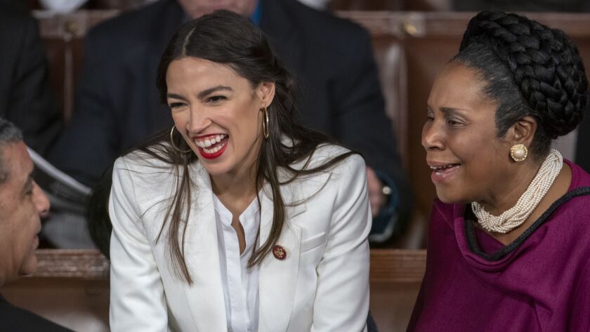 Rep. Alexandria Ocasio-Cortez (D-N.Y.), left, with Rep. Sheila Jackson Lee (D-Texas) on the opening day of the 116th Congress in Washington on Thursday.