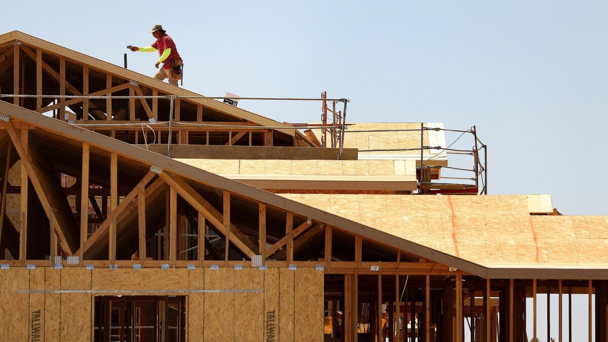New homes are under construction in Victorville on Sept. 2.