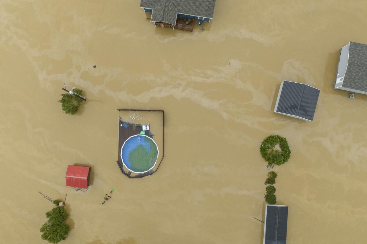 An aerial view of homes and structures flooded 