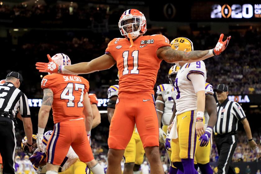 NEW ORLEANS, LOUISIANA - JANUARY 13: Isaiah Simmons #11 of the Clemson Tigers celebrates a defensive stop against the LSU Tigers during the first quarter in the College Football Playoff National Championship game at Mercedes Benz Superdome on January 13, 2020 in New Orleans, Louisiana. (Photo by Mike Ehrmann/Getty Images)