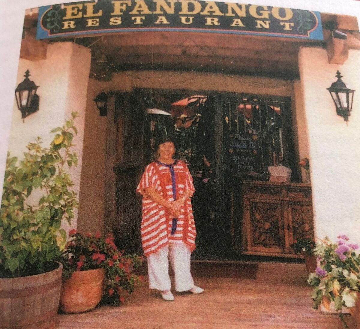 Consuelo "Connie" Puente Miller photographed in front of her El Fandango Restaurant in Old Town, which closed in 2013.