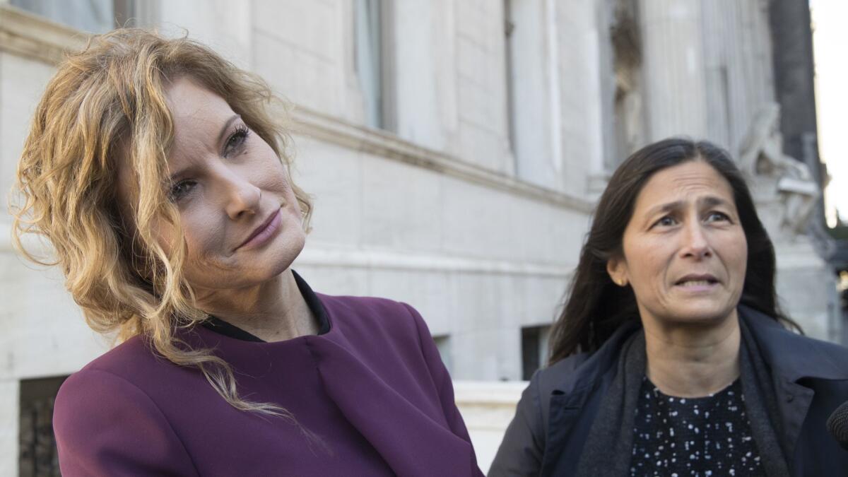 Summer Zervos, left, and her attorney Mariann Wang speak to reporters outside New York state appellate court on Oct. 18.